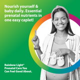 Pregnant woman smiling, holding baby shoes over belly and gesturing up for Prenatal One Multi.