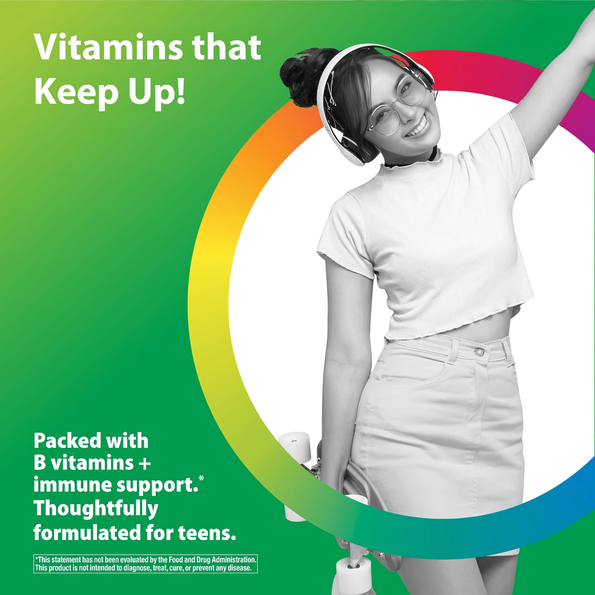 Teenage girl smiling with headphones and glasses, raising an arm, holding a Teen Multivitamin.