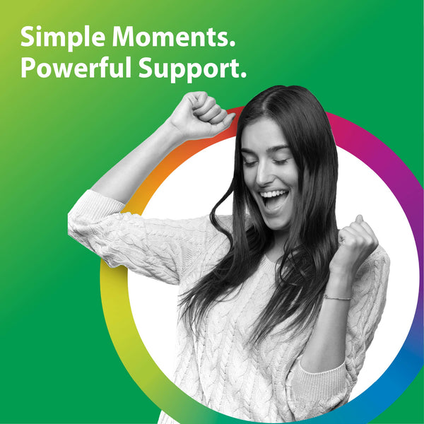 Young woman cheering with fists raised, smiling broadly, to celebrate Magnesium Glycinate Gummy.