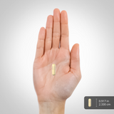 A hand holding a capsule measuring 0.917 inches or 2.330 centimeters in length.